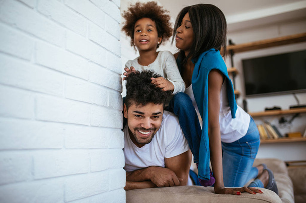 Portrait of african american family playing together at home. - Photo, Image