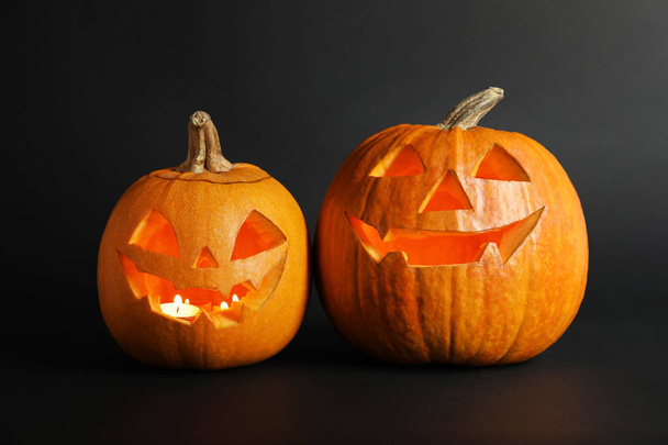 Halloween pumpkin head jack lanterns on dark background - Foto, Bild