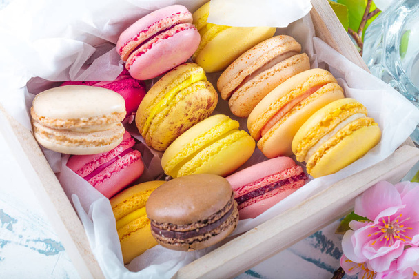 Sweet and colorful french macaroons on vintage background  - Photo, Image