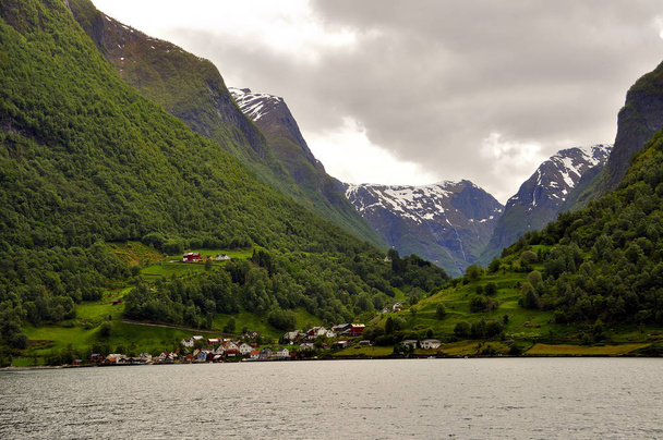 Sognefjord fjord runs through the famous town of Flam famous for its landscapes and its tourist train - Photo, Image