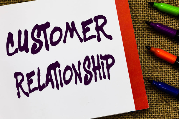 Handwriting text Customer Relationship. Concept meaning Deal and Interaction between Company and Consumers Open notebook page jute background colorful markers Expressing ideas. - Photo, Image