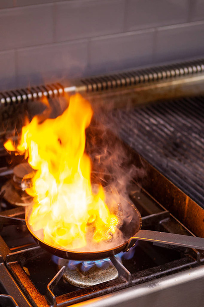 Chef making great flambe beef - Fotoğraf, Görsel