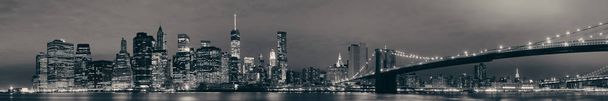 Manhattan Downtown urban view with Brooklyn bridge at night - Photo, Image
