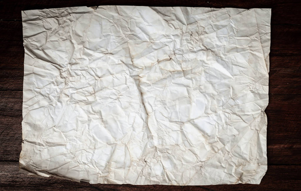 Background texture of crumpled aged paper with spot and stain - Foto, Bild