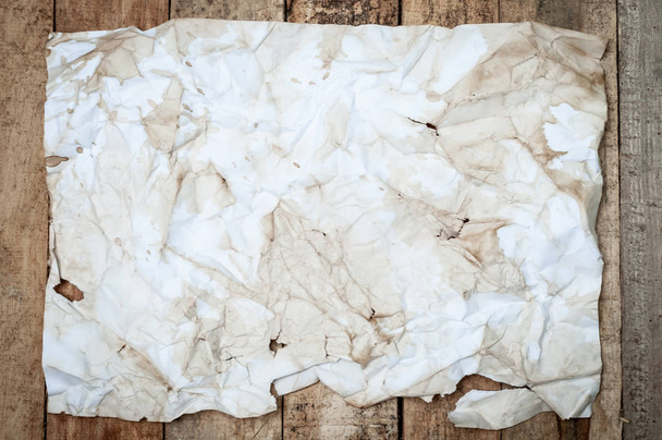 Vintage Crumpled paper texture on wooden table - 写真・画像