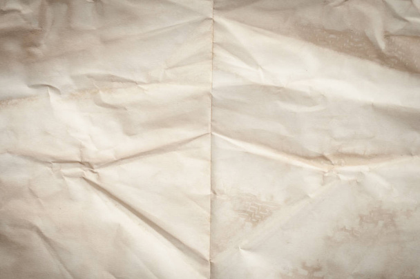 Background texture of crumpled aged paper with spot and stain - Foto, afbeelding