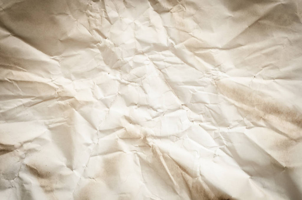 Background texture of crumpled aged paper with spot and stain - Photo, Image