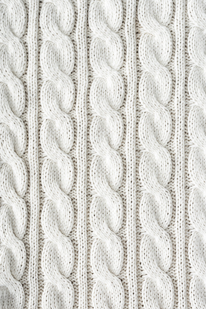full frame of white knitted cloth with pattern as background - Foto, imagen