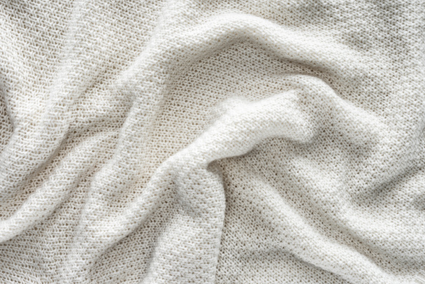 full frame of wavy white knitted cloth as background - Фото, зображення