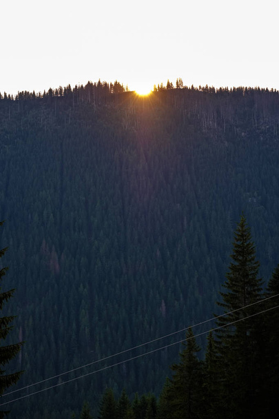morning light rising over hill tops and forests in mountains Tatra in Slovakia, first rays of light - Photo, Image