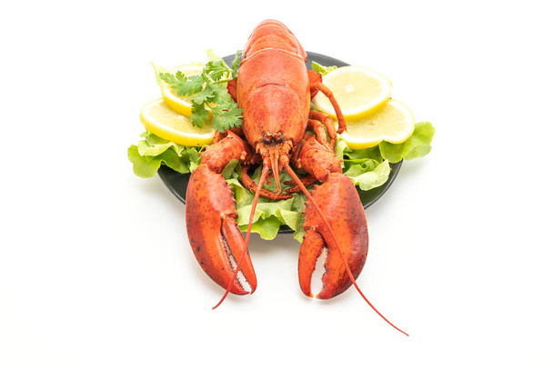 freshly boiled lobster with vegetable and lemon isolated on white background - Fotó, kép