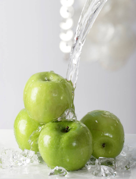 water pouring on pile of green apples, close-up   - Fotó, kép