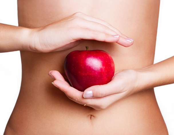 vrouwelijk lichaam met apple - Foto, afbeelding