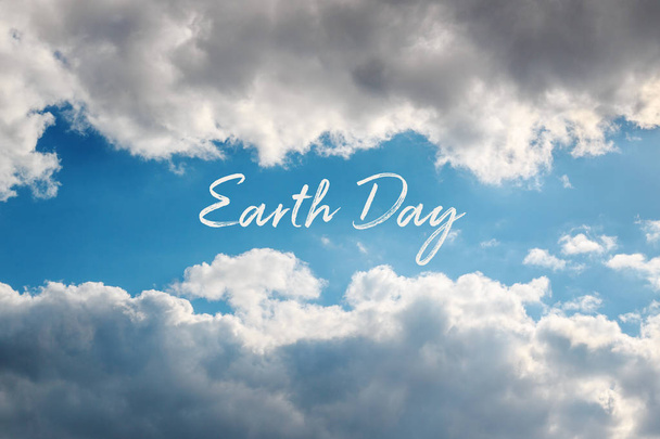 Natural frame of clouds in the sky with text Earth Day. April 22 concept card. - Photo, Image