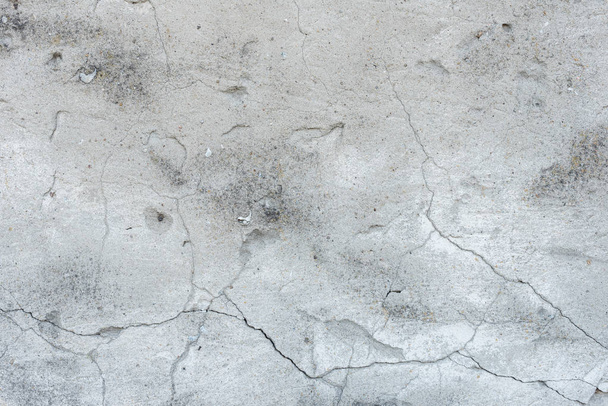 Wall fragment with scratches and cracks. It can be used as a background - 写真・画像