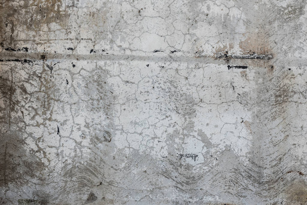 Фрагмент стены с царапинами и трещинами. Его можно использовать в качестве фона
 - Фото, изображение