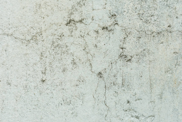 Wall fragment with scratches and cracks. It can be used as a background - Photo, Image