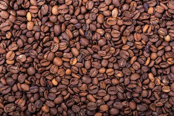 Fresh roasted coffee beans for background or texture - Valokuva, kuva