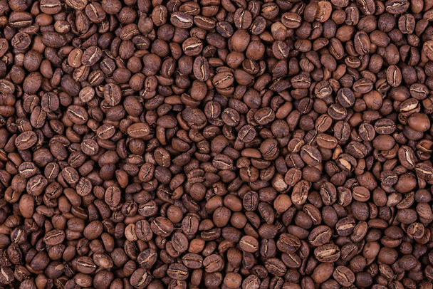 Roasted arabica coffee beans background or texture - Фото, изображение
