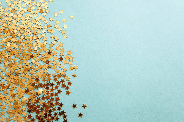 Festive background of golden confetti stars - Foto, Imagen