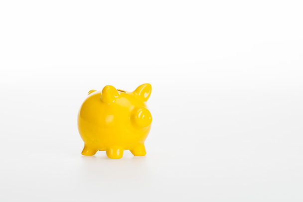 close up view of yellow piggy bank isolated on white background - Fotografie, Obrázek