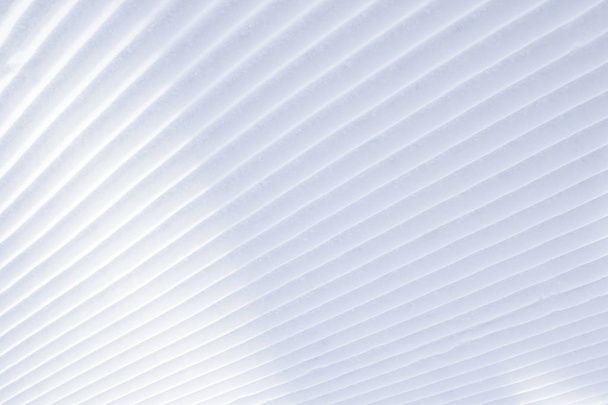 Background of diagonal geometrical parallel stripes of snow with light shadow - Photo, Image