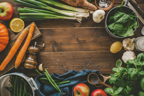 Fresh vegetables ingredients for cooking placed on wooden. Concept of cooking natural, eco, bio, vegan or vegetarian healthy lifestyle. Horizontal with copy space.  - Foto, imagen