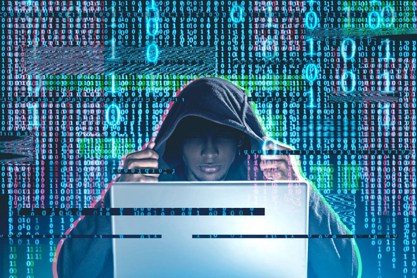 African American man w Bluza z kapturem, patrząc na laptopa na tle niebieski, czerwony i zielony liczb binarnych. Wciągające interfejs z świecące zer i jedynek. Bezpieczeństwo online Toned obrazu podwójnej ekspozycji - Zdjęcie, obraz