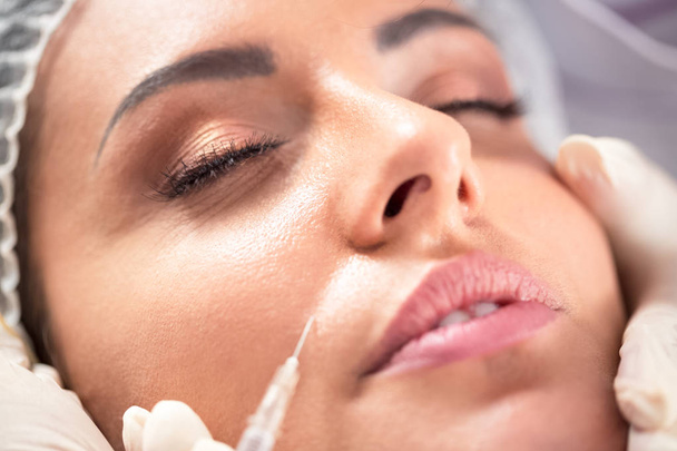 Close up of wrinkle botox repair in a beauty salon - Photo, Image