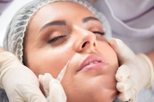 Close up of wrinkle botox repair in a beauty salon - Photo, Image