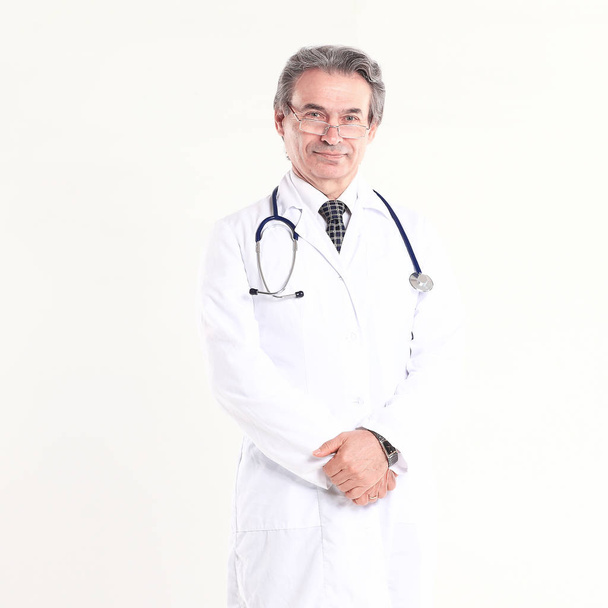 in full growth.experienced physician with stethoscope .isolated on white background - Fotografie, Obrázek