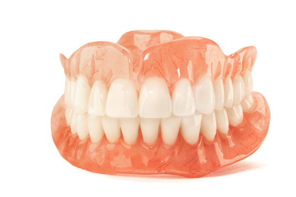 Close-up of plastic denture teeth isolate no fond background. New technologies in modern dentists. - Photo, Image