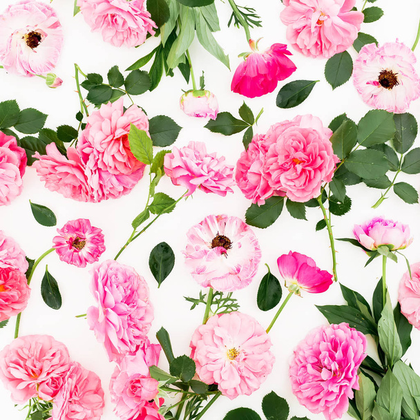 Floral pattern of roses flowers and leaves on white background. Flat lay, top view. Natural composition. - Photo, Image