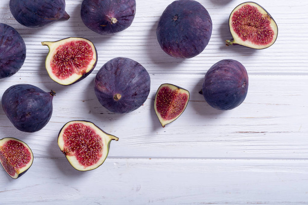 Fresh autumn fruit figs . Healthy food on rustic background - Photo, Image