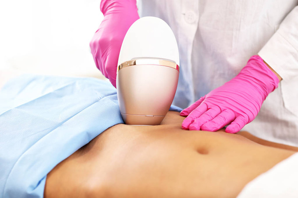 Adult woman having laser hair removal in professional beauty salon - Photo, Image