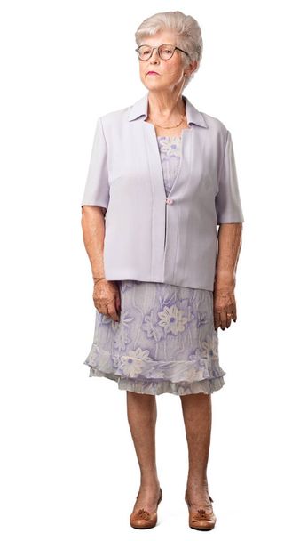 Full body senior woman doubting and confused, thinking of an idea or worried about something - Photo, image