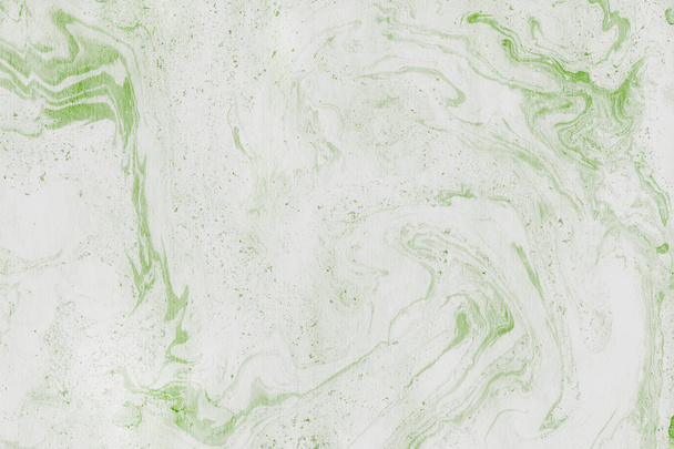 Зеленый мраморный фон с брызгами краски текстуры
 - Фото, изображение