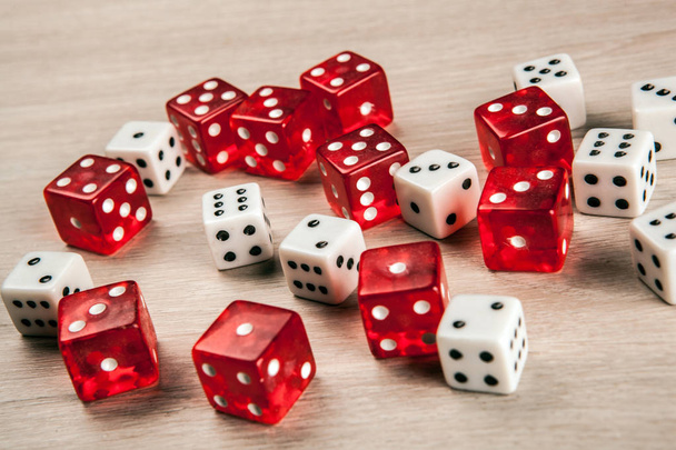 white and red dice scattered on the table close up - Photo, Image