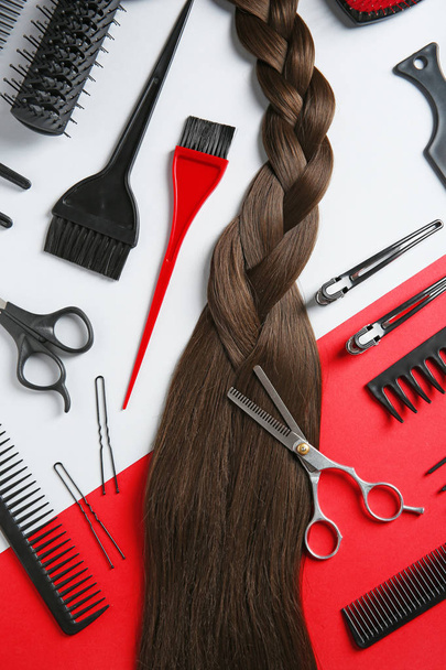 Flat lay composition with hair salon tools on color background - Fotó, kép