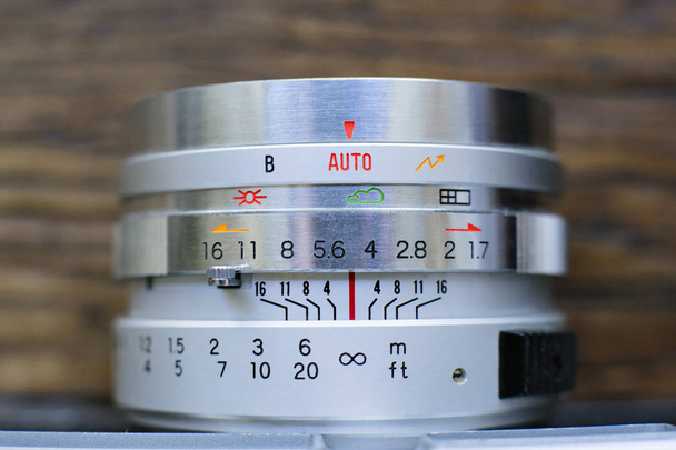 Macro of vintage camera lens aperture and focusing ring - Photo, Image