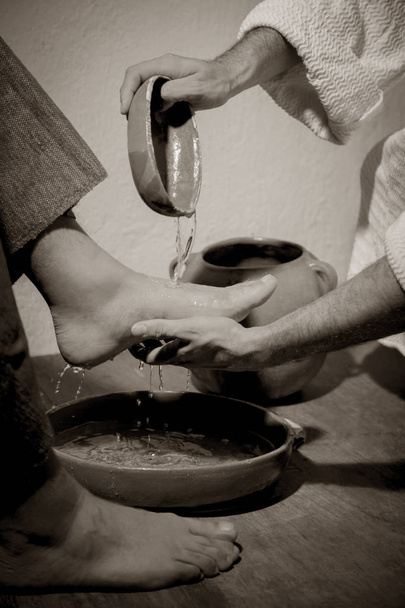 Jesus Christ washing the feet of his disciples in sign of humility and service - Foto, Imagem
