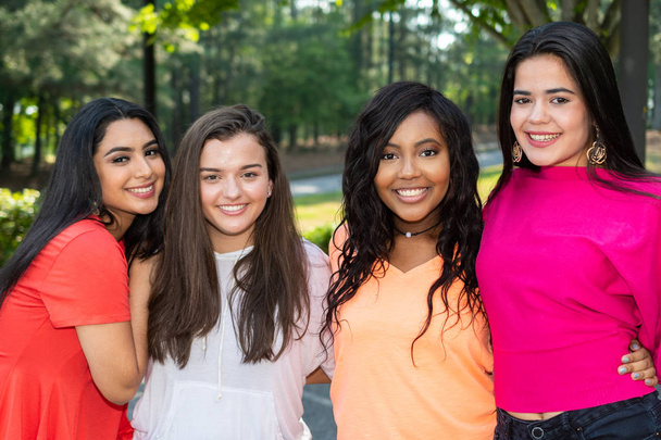 Group of four teenage female friends of different races - Fotografie, Obrázek