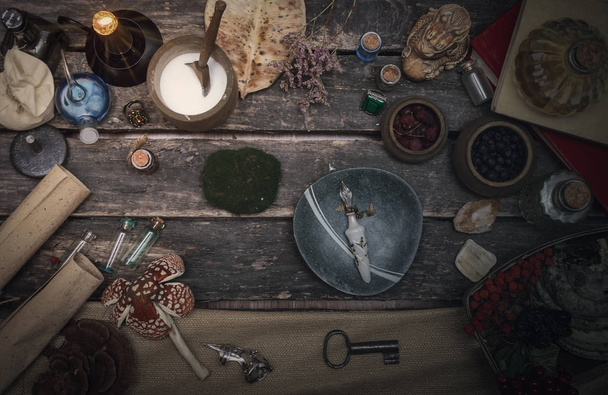 Magic potion preparation on the table of magician. Witchcraft or druidism concept background. - Fotoğraf, Görsel