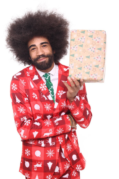 Happy black man with Christmas present - Φωτογραφία, εικόνα