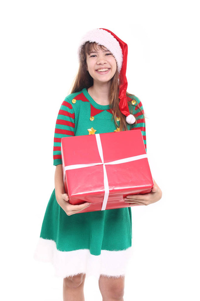 Beautiful teenage girl with christmas gift - 写真・画像