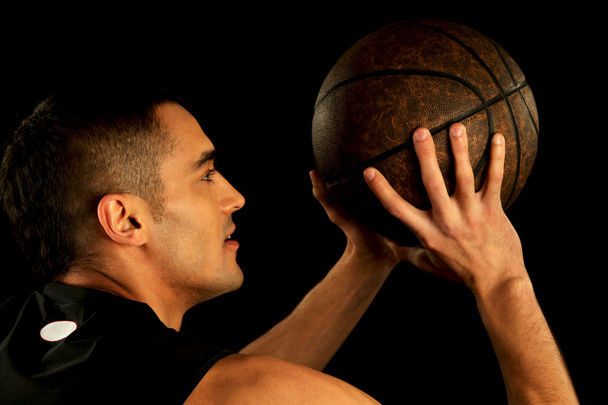 Basketball player holding ball - Φωτογραφία, εικόνα