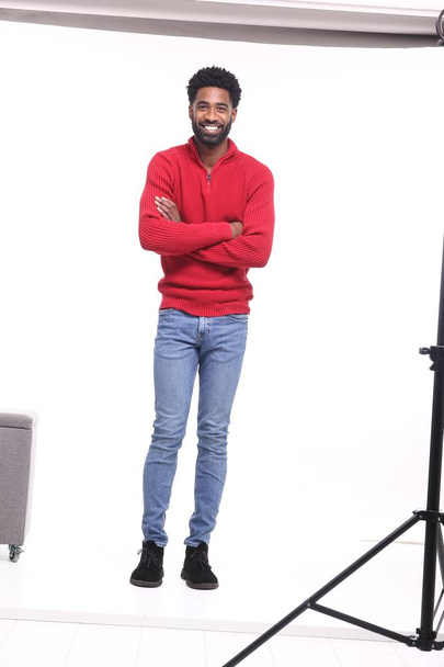 Happy black man posing in studio - Fotoğraf, Görsel