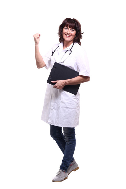 Happy female doctor with stethoscope and folder - 写真・画像