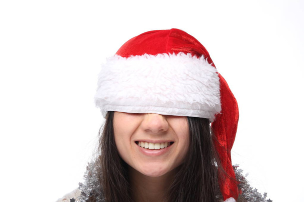 Happy young asian girl is wearing Christmas hat - Fotoğraf, Görsel