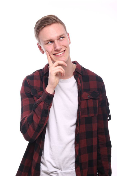 Caucasian young man is smiling - Foto, afbeelding